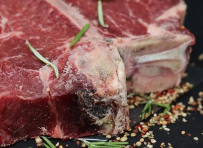 Frugal shopper removes bone from T-Bone steak to reduce grocery bill